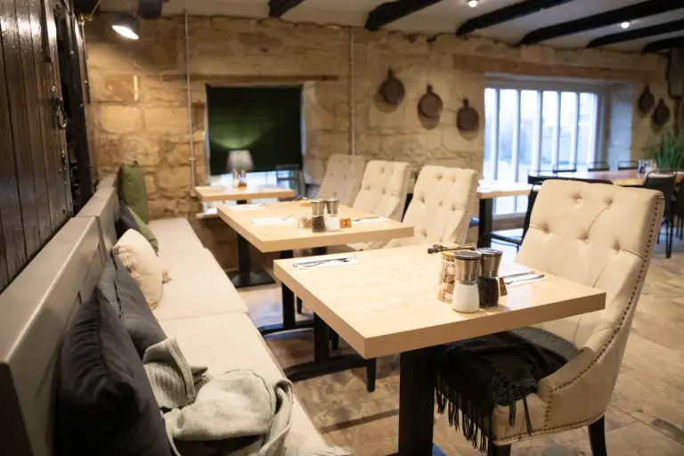 Elegant Dining Booths with Cream Chairs